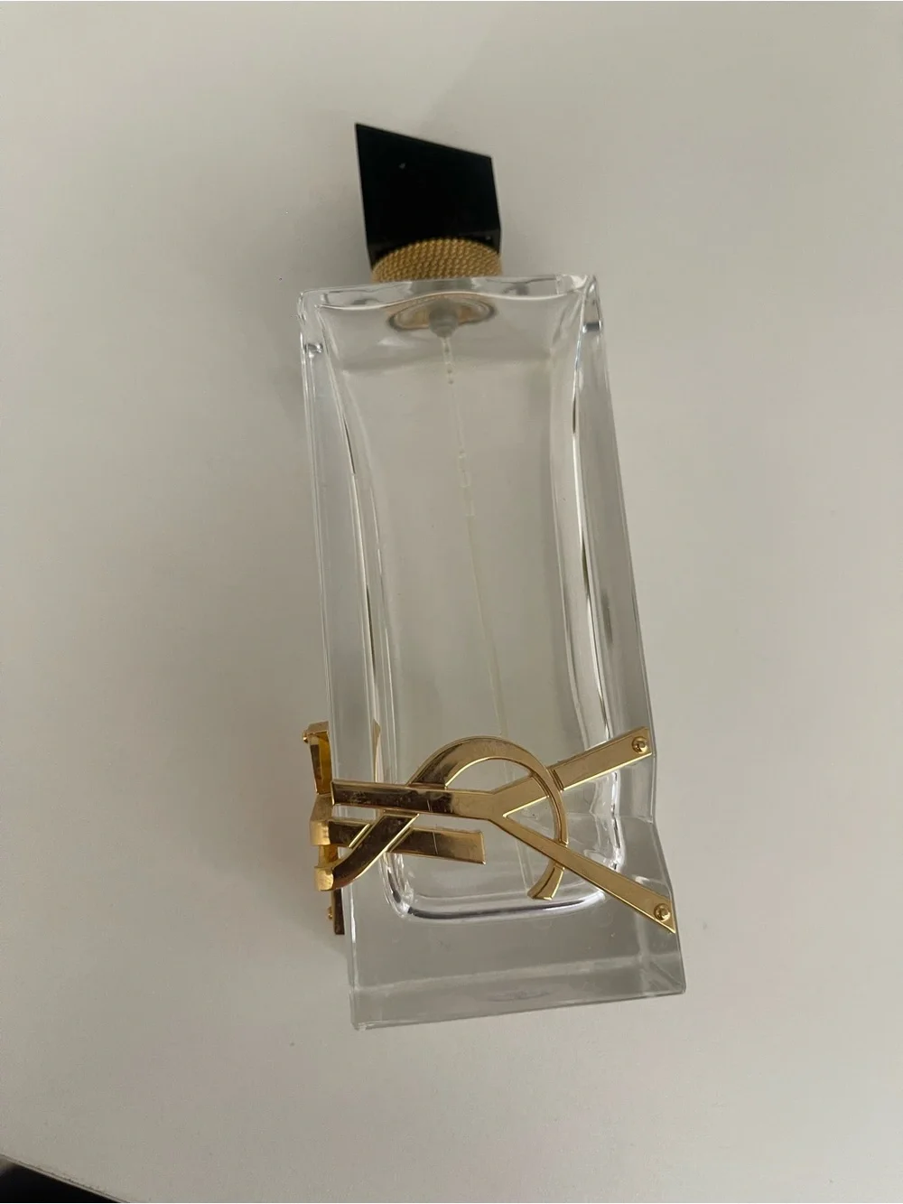 Yves Saint Laurent Clear Glass Bottle with Black Cap and Gold Accent - Picture 2 of 7